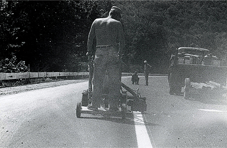 Men painting the white line marking on a roads . 1936